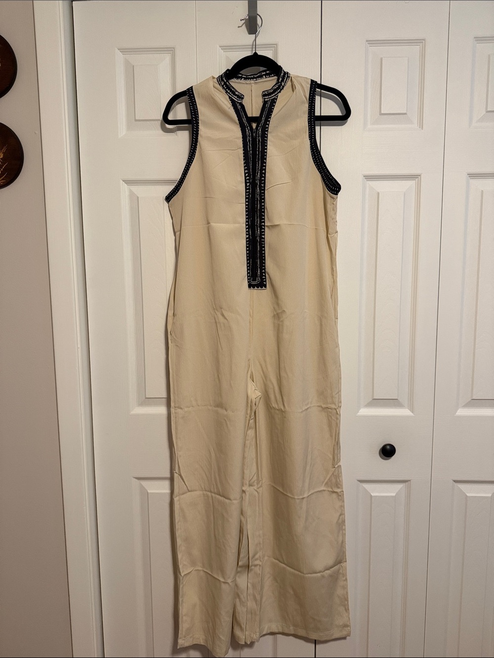 Sleeveless Cream Jumpsuit with Black Trim